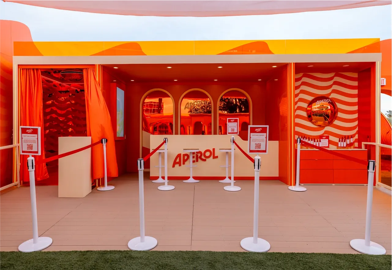 Wide view of the lines to experience the Aperol bar at Coachella 2026