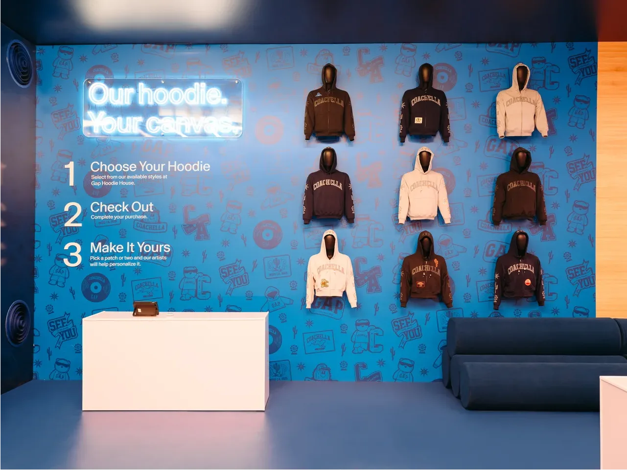 Hoodies hang on the wall of the Gap Hoodie House activation at Coachella 2026