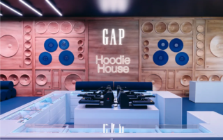 Shirt presses and the wooden speaker facade wall inside the Gap Hoodie House activation at Coachella 2026