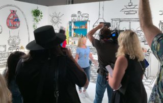 A woman stands in a room of custom fabrication by Fuller Street at Catcon Pasadena