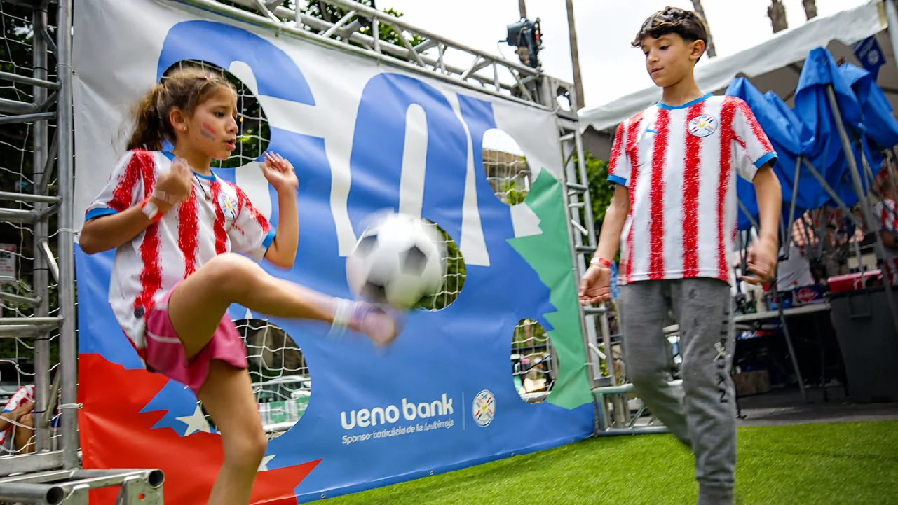 casa-albirroja-match-day-fan-zone-soccer-goal Young Paraguay World Cup fans kick a soccer ball in front of a GOAL game built by Fuller Street for the Casa Albirroja Fan Experience in Los Angeles