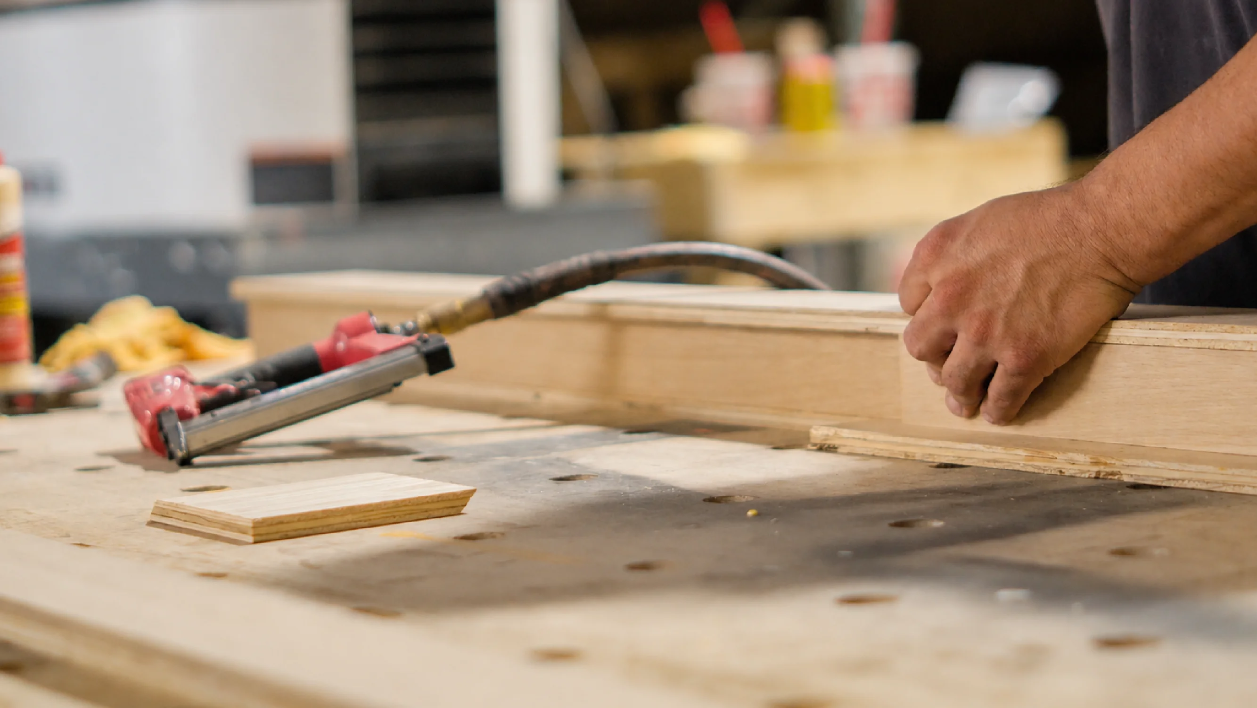 A carpenter assembles pieces for experiential fabrication services by Fuller Street in Los Angeles