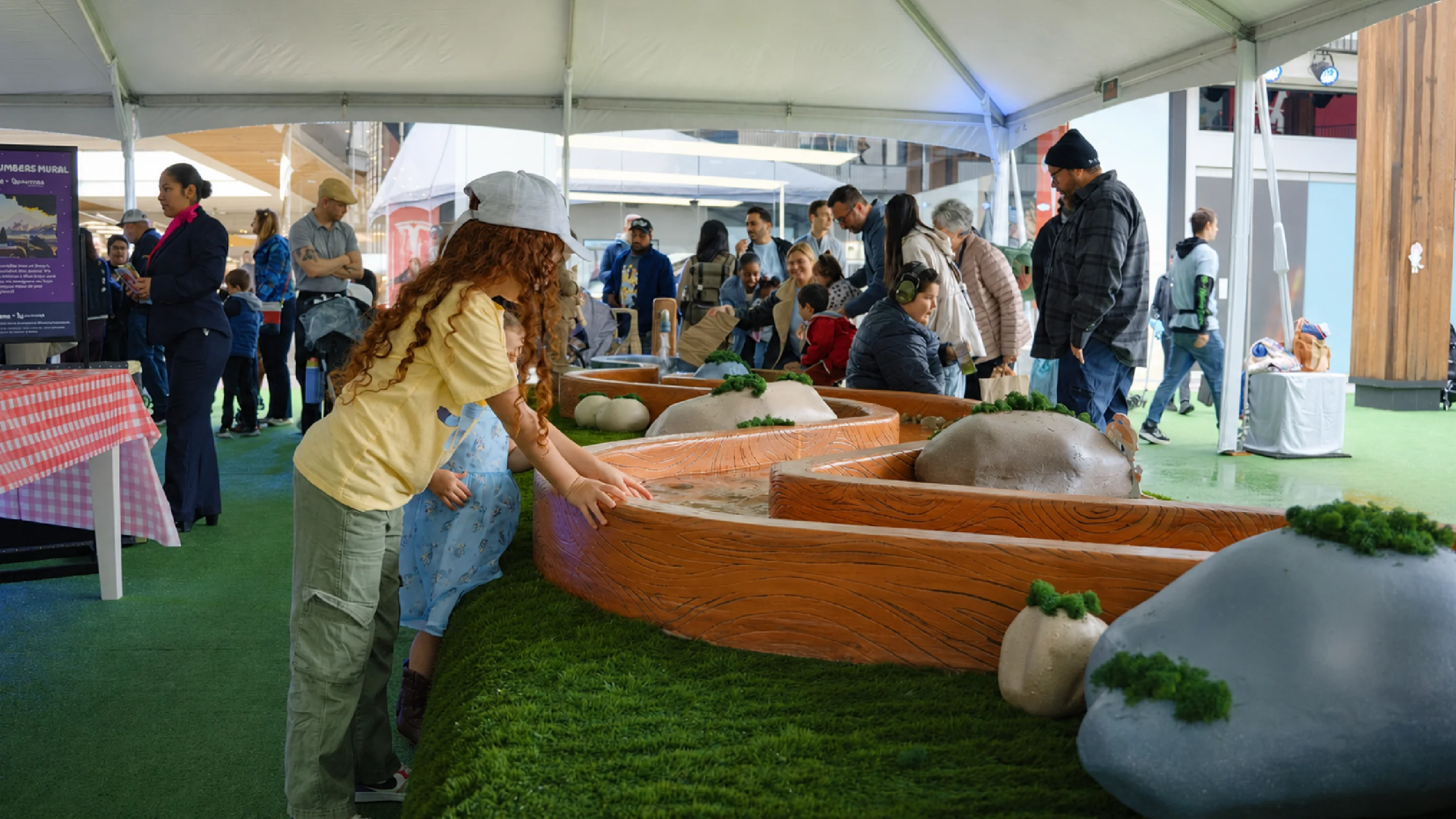 Families enjoy the fun of Bluey's Barky Boats activation in Los Angeles built by Fuller Street for experiential fabrication